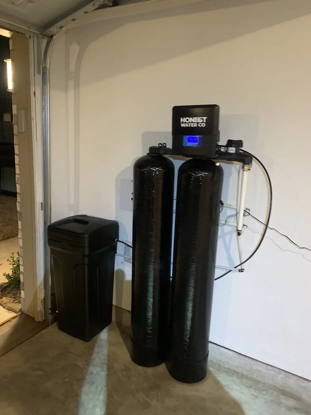 Dual-tank system inside a garage door